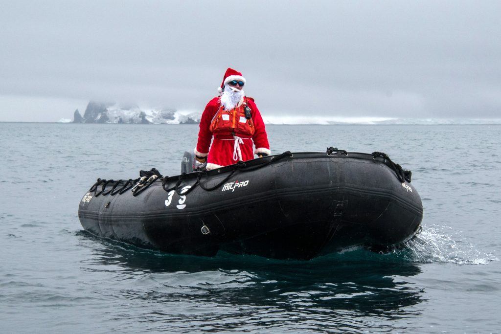 Scientists tagging whales in Antarctica