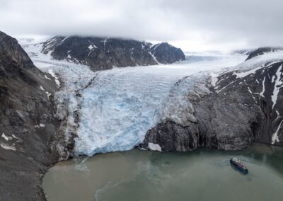 View of glacier and ship in front of the glacier