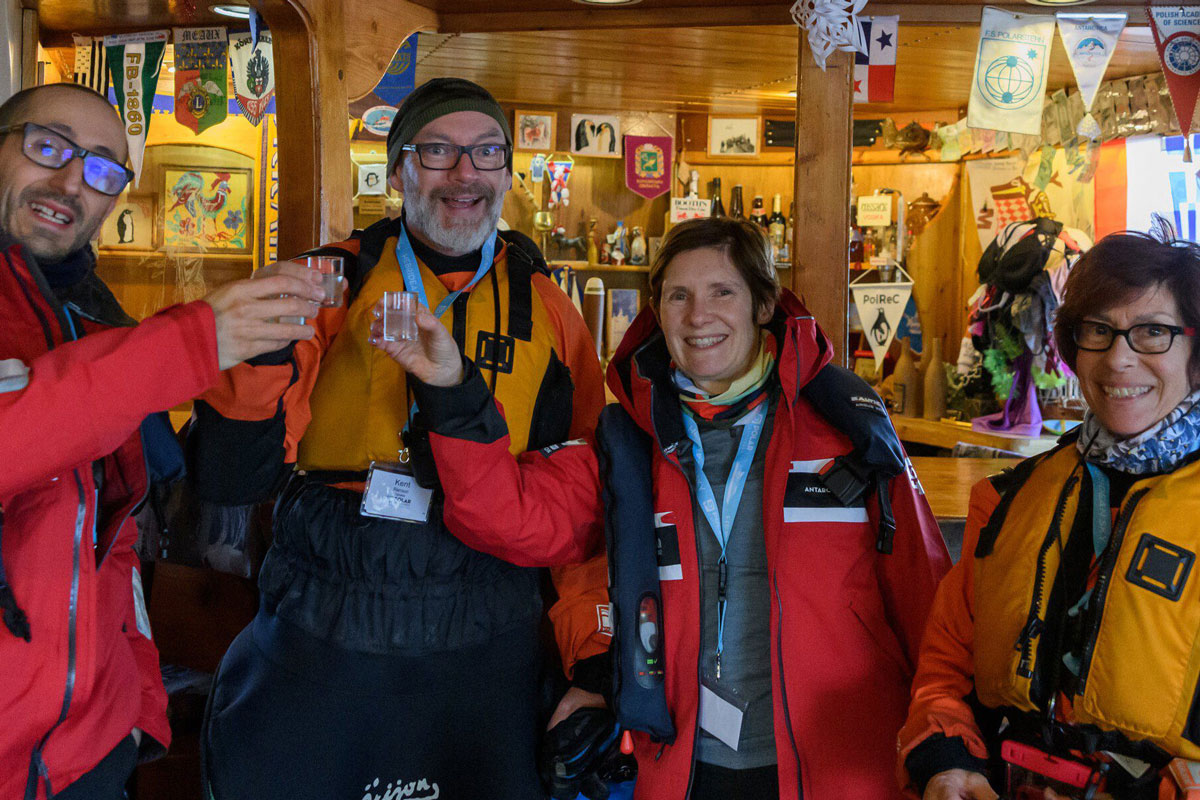 Visitors enjoying a drink at the Vernadsky Station bar in Antarctica