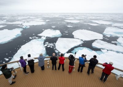 Guests standing at Ship Bow, looking at pack ice