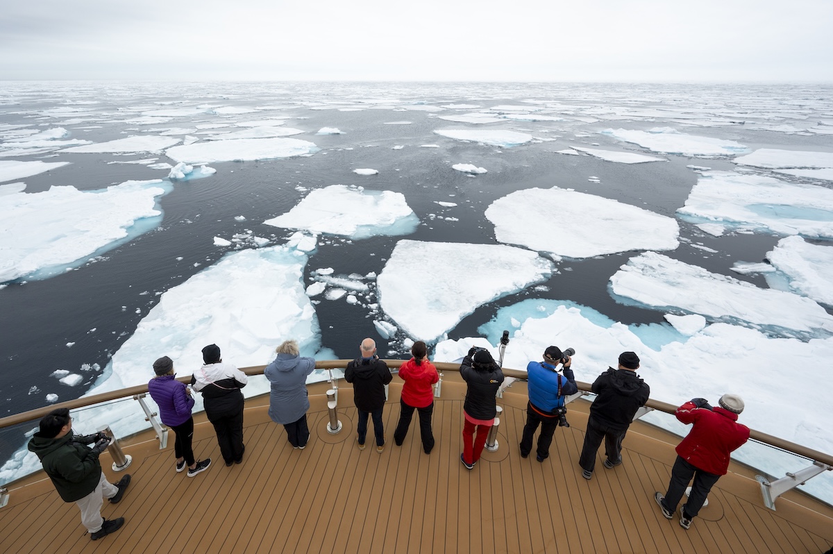 Guests standing at Ship Bow, looking at pack ice
